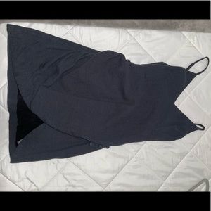 Little black dress, wore twice, has two 3 buttons near the slit and a zipper.